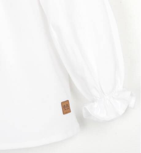 Blusa bebé blanca cuello volante de José Varón | Aiana Larocca